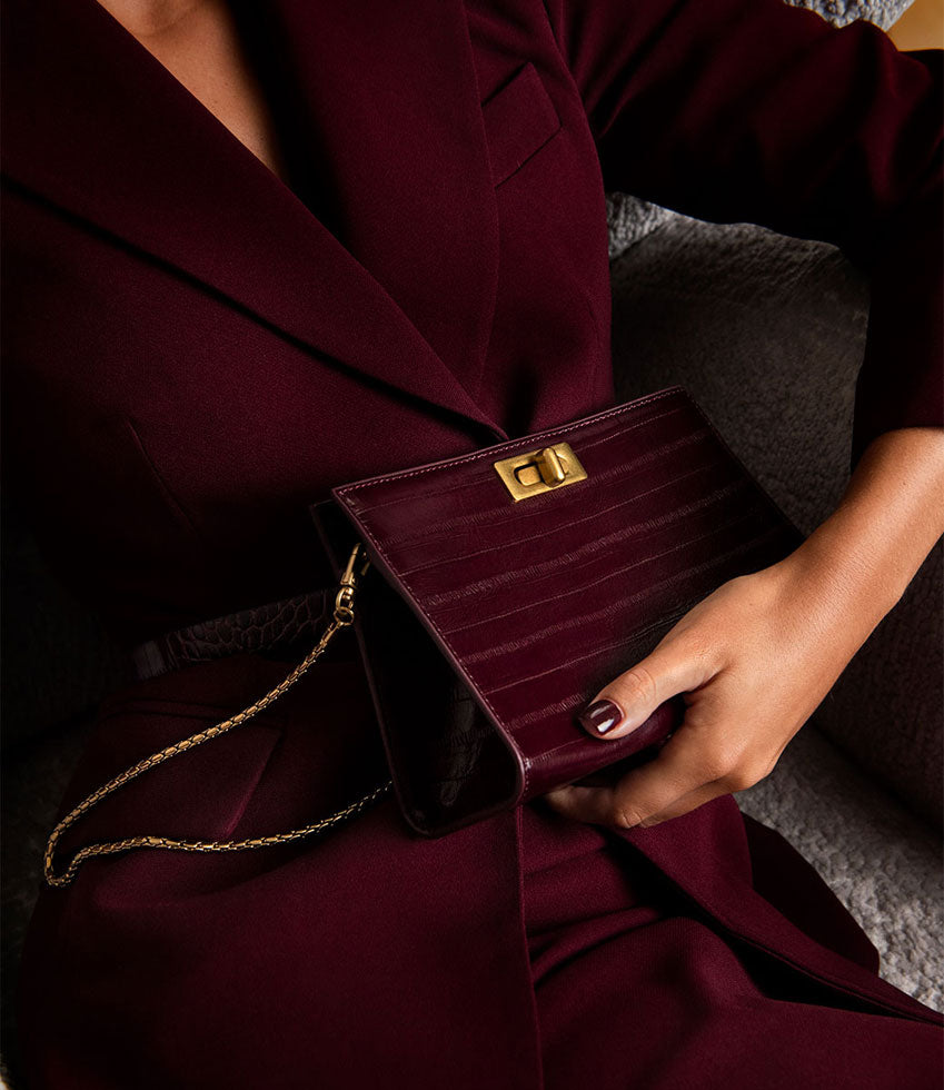 NAYLA Bag with Twist Hardware in Black Cherry Eel Print - Edward Meller
