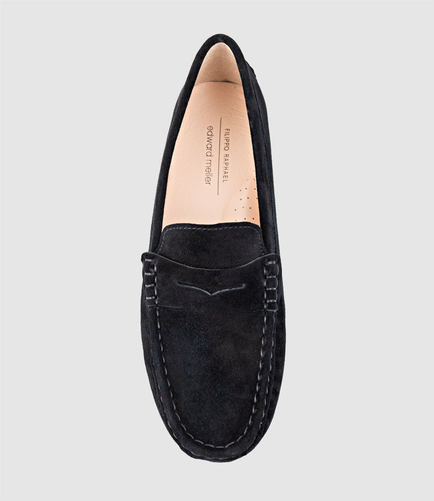 Black loafer shoe on a light grey background