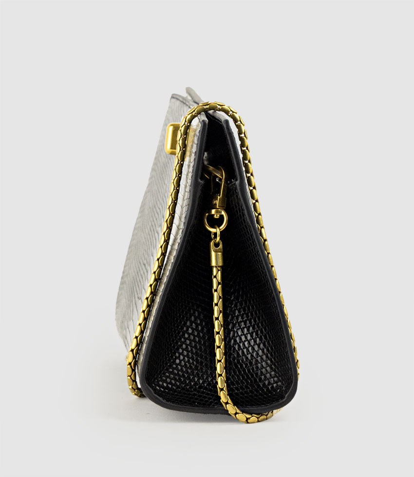 NAYLA Bag with Twist Hardware in Black Tejus Lizard Print - Edward Meller