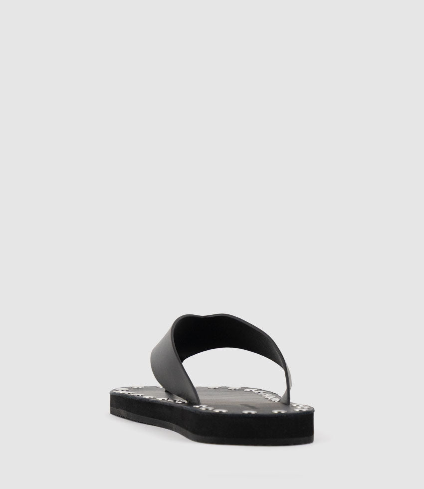 THEA Leather Thong on Studded Sole in Black - Edward Meller