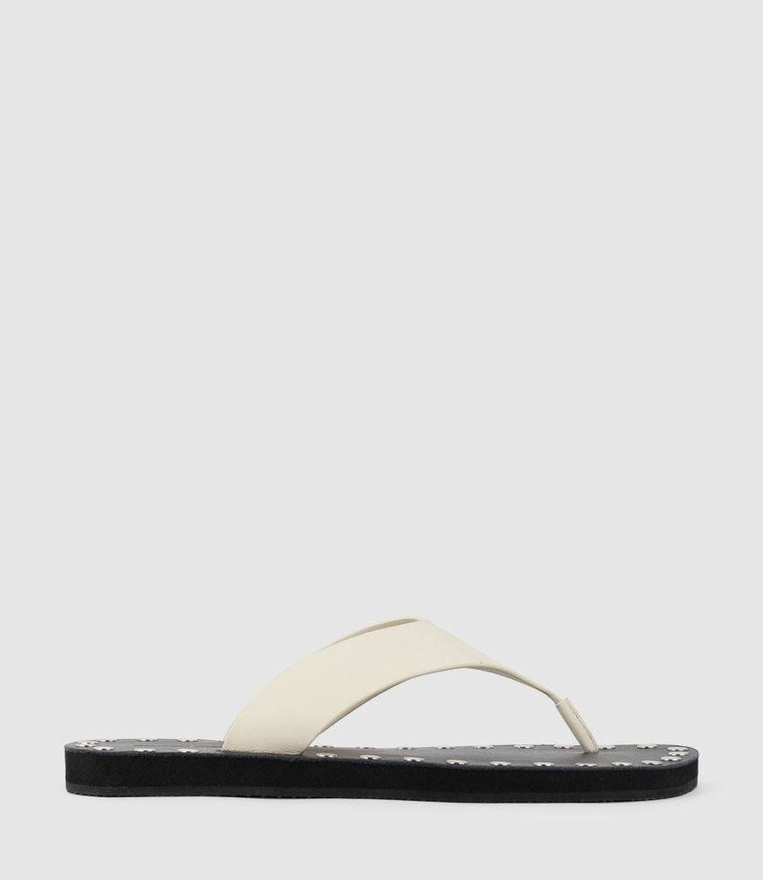 THEA Leather Thong on Studded Sole in Offwhite - Edward Meller